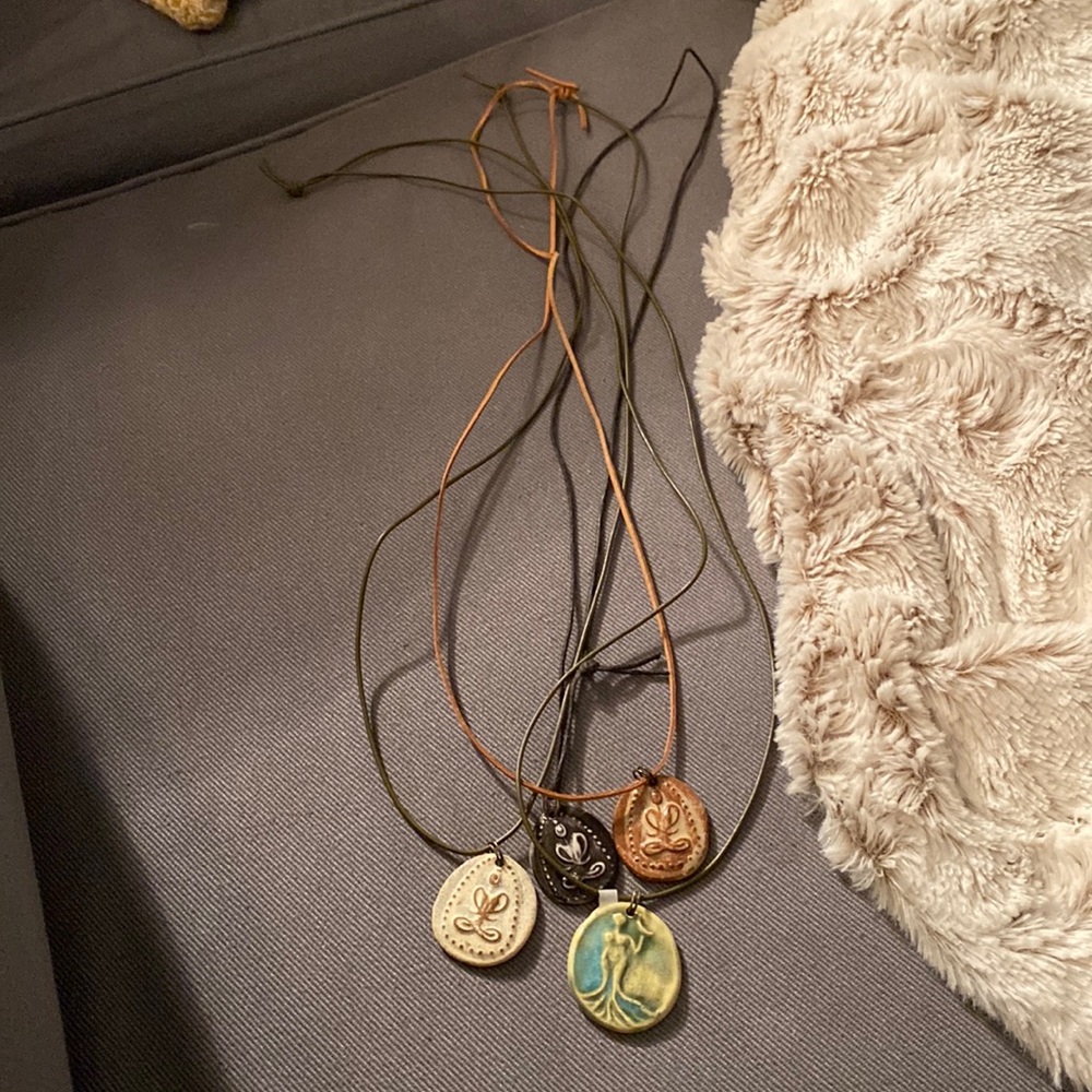 Long. Can be tied to any length. Set. Clay and leather.